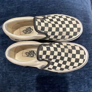 Kids black and white checkered slip on Vans